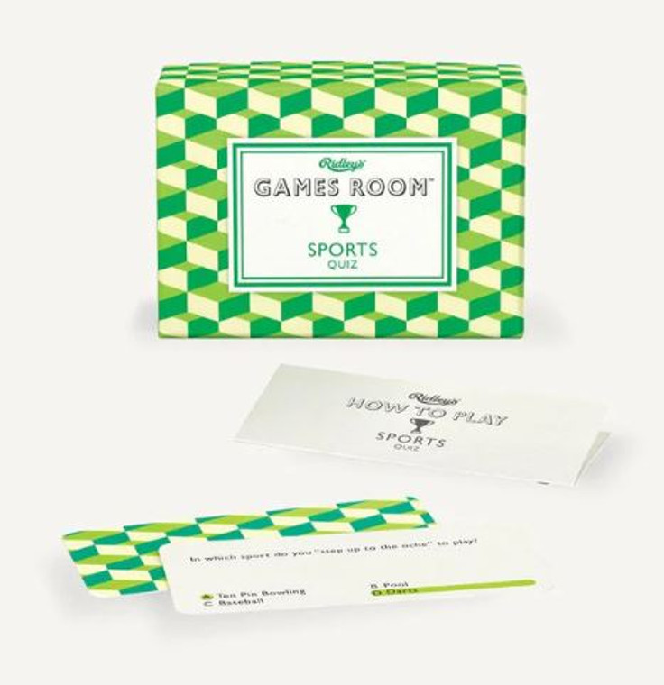 A box with a green and white checkered design next to the instruction booklet and two sample cards of sports trivia.