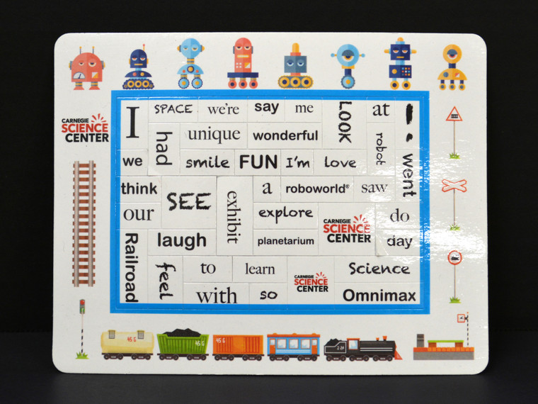 A magnetic photo frame with a white, science-themed border and magnetic tiles with words relating to the Carnegie Science Center.