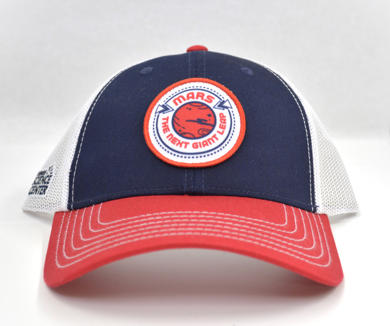 A front view of a red, white, and blue baseball cap with the logo for the Carnegie Science Center permanent exhibit Mars: The Next Giant Leap.