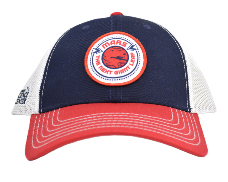A front view of a red, white, and blue baseball cap with the logo for the Carnegie Science Center permanent exhibit Mars: The Next Giant Leap