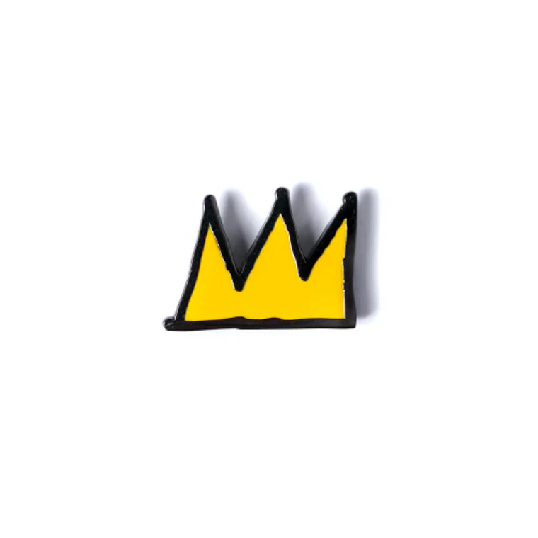 Close up of the yellow crown enamel pin.