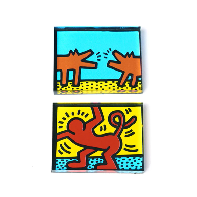 Two acrylic magnet sets with Keith Haring artwork.