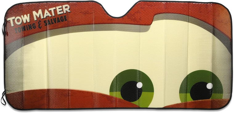 A vehicle windshield sun shade with the brown eyebrows and green eyes of Mater the Tow Truck.