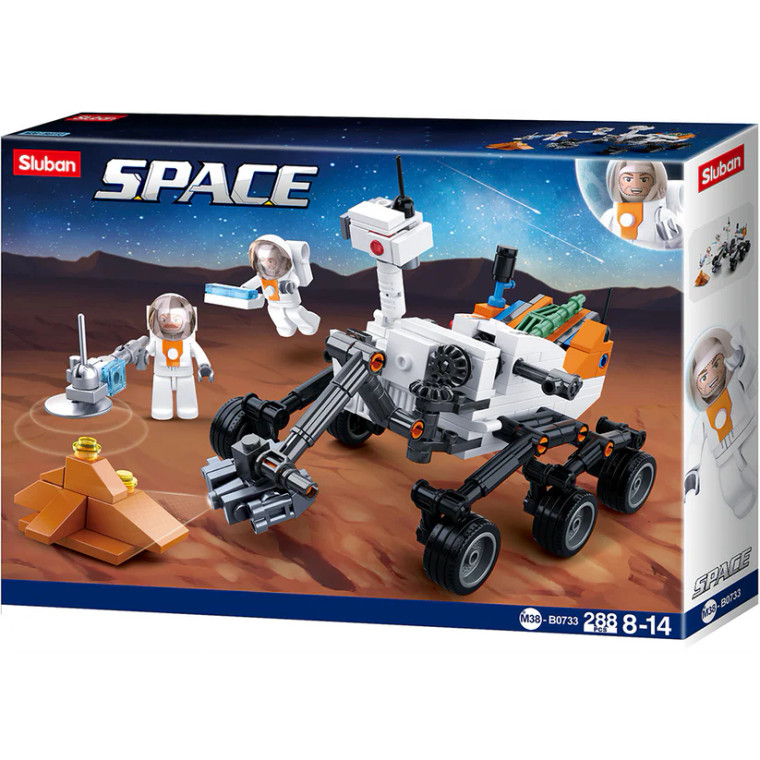 A box with a toy brick Curiosity Rover and two brick figure astronauts.