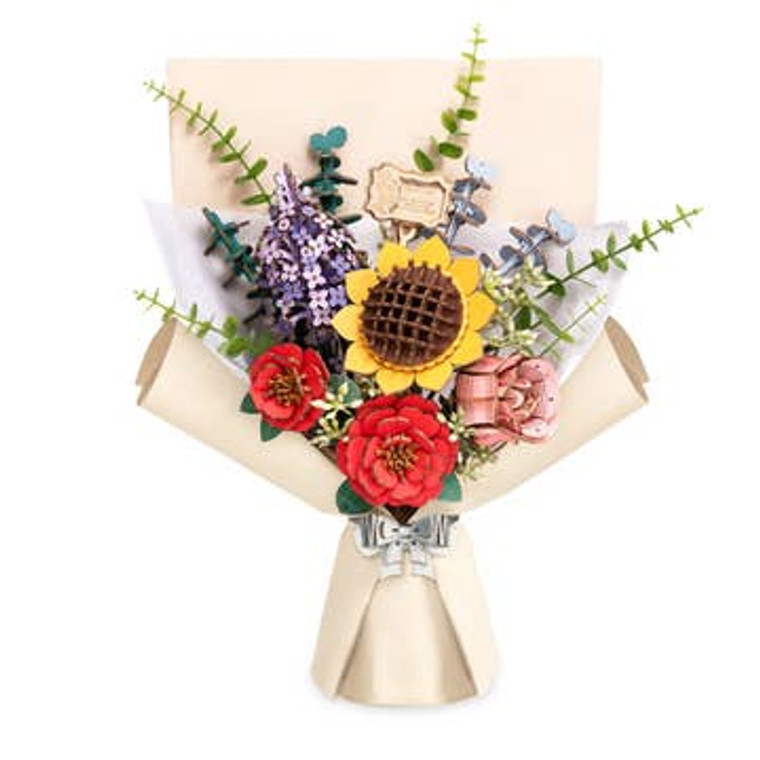 shows the assembled bouquet featuring a sunflower, lilac and camellia blooms