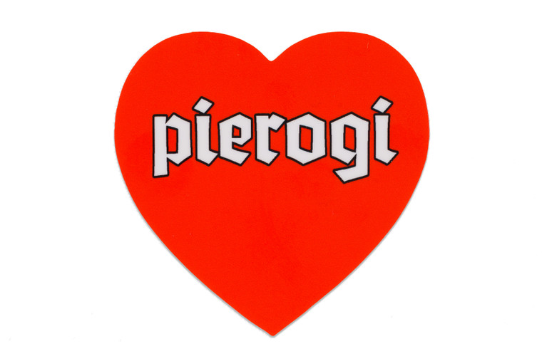 Red heart shaped sticker, white text, pierogi
