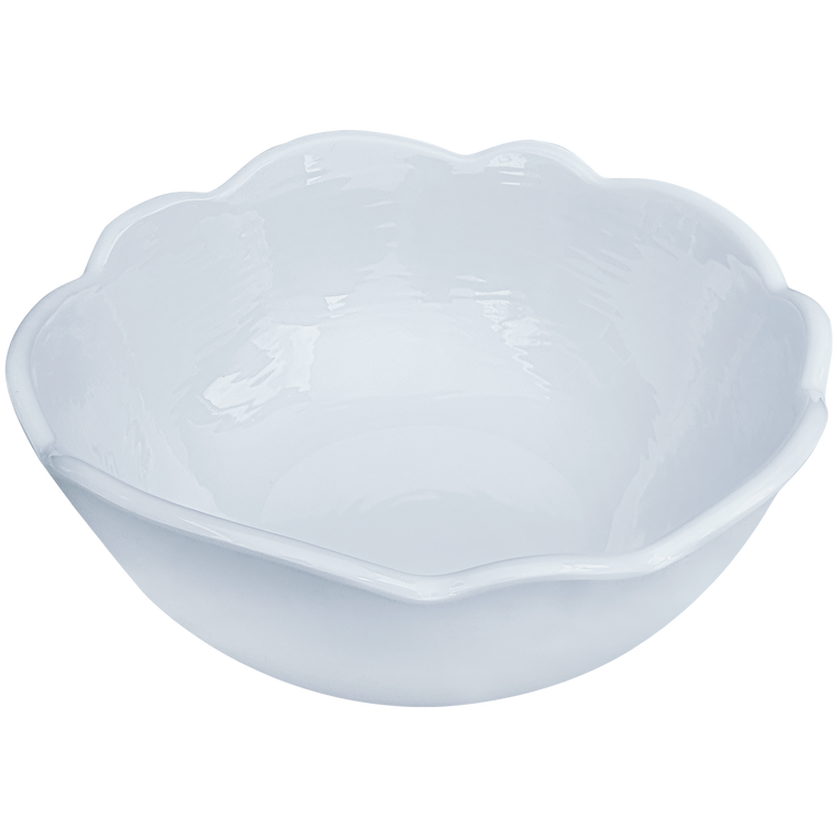 White soup bowl with scalloped edges.