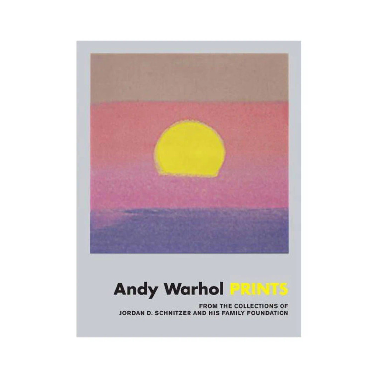Silver colored book, Warhol sunset artwork on the cover, title "Andy Warhol Prints"