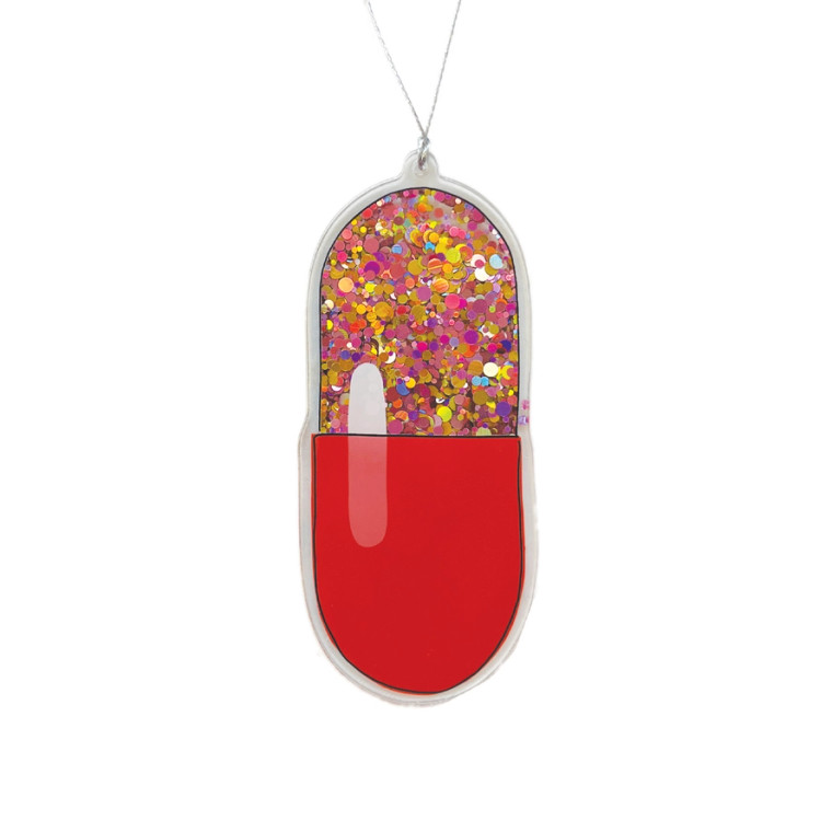 Pill shaped acrylic ornament, half red the other clear with sparkles so you can shake.
