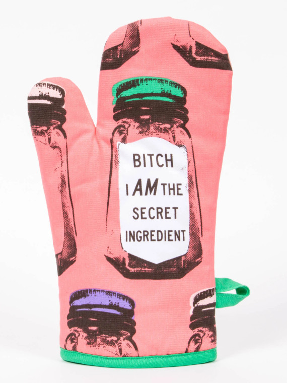 Pink oven mitt, with seasoning shakers all over print, text in black "bitch, I am the secret ingredient".