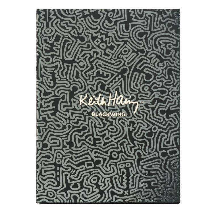 The gift box, in black with white line art work by Keith Haring.