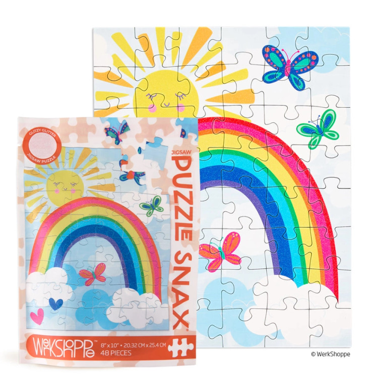 The packaging displayed next to the completed puzzle.