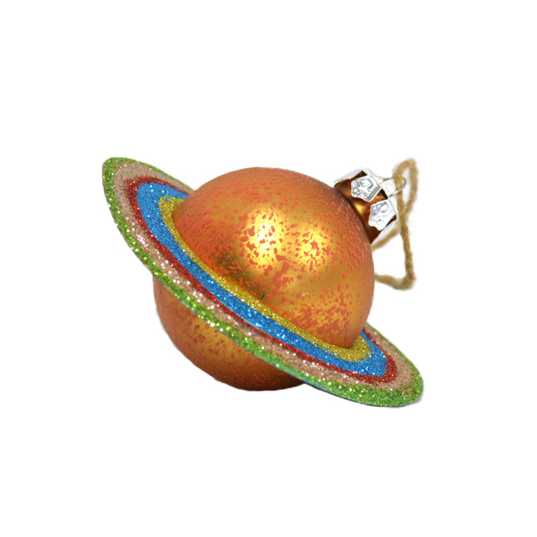 A glass ornament orb painted gold with a plastic, multicolored ring at an angle