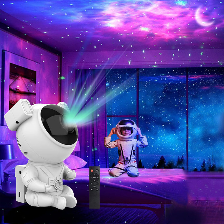 A plastic astronaut projection lamp in front of the lighting type it projects in a child's bedroom