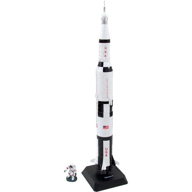 An assembled scale model of the Saturn V rocket with a not-to-scale astronaut figurine