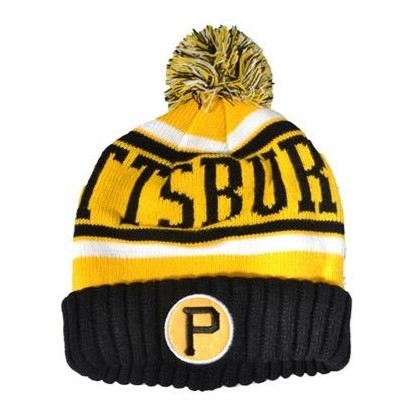 A knit beanie hat in gold with black trim, the word "PITTSBURGH" and a singular "P" in black, and a black, gold, and white pompom