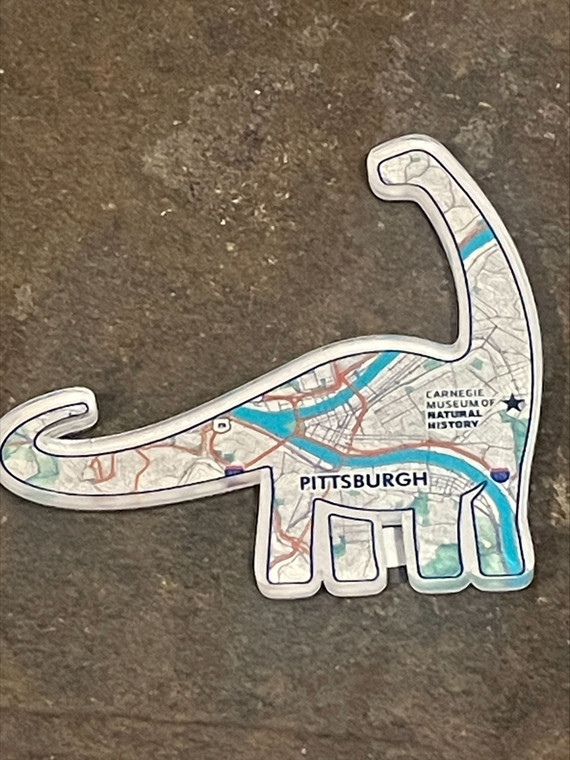 Magnet in shape of Dippy Carnegie Museum logo featuring map of city of Pittsburgh