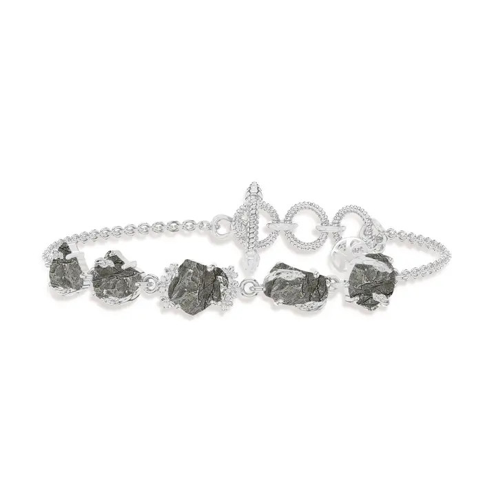 A bracelet featuring five meteorites set in sterling silver