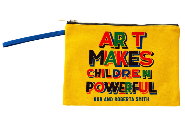 Yellow zippered pouch with colorful text, "Art Makes Children Powerful".