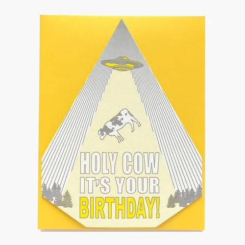 Die cut card, illustration of a cow beamed up by a ufo, text: Holy Cow it's your birthday