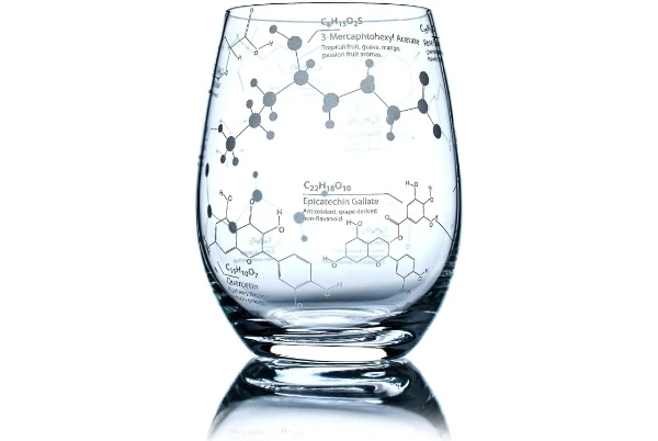 A stemless wine glass etched with the models of molecules found in wine