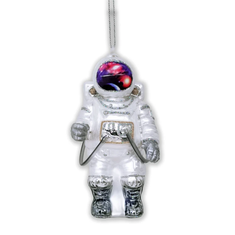 A hand-painted, blown-glass ornament in the shape of a space-walking astronaut