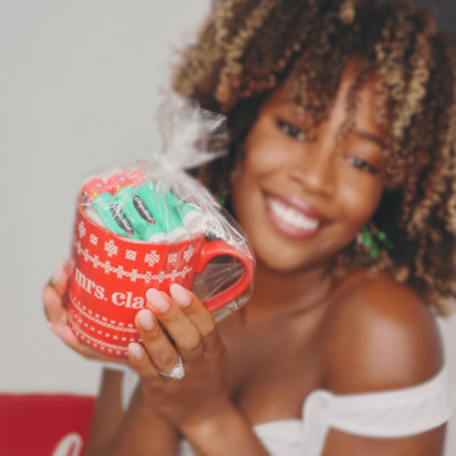 Young girl holding customized christmas chapstick in a mug. Young girl holding customized christmas chapstick in a mug.