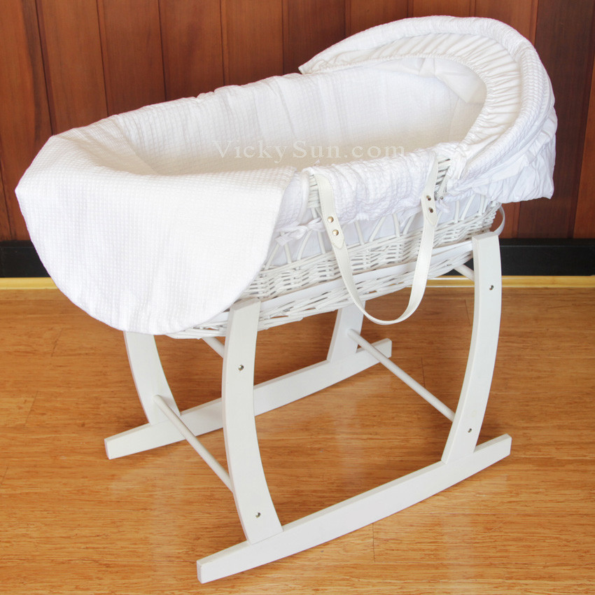 white wooden bassinet