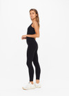 THE UPSIDE women's black Peached 25in Midi Pant is a mid-rise 7/8 length legwear made from recycled soft peached fabric with breathable and moisture-wicking fabrics.