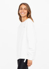 THE UPSIDE women's white Saturn Arrow Sweater is an organic cotton fleece jumper with a relaxed, oversized fit. It features a soft rib at the neckline, handcuffs and cuffs.