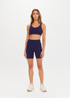 THE UPSIDE women's navy blue Peached Jade Bra is a sustainable scoop neck, full coverage T-back bra with internal elastic in the underbust and removable cups.