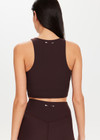 THE UPSIDE Peached Florence Flare in Dark Brown is a sustainable high-rise full length flare pant with a “V” shaped waistband detail and printed arrow logo at back waistband.