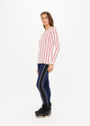 THE UPSIDE Alpine Chrissy Knit Top in Striped Red and White is a sustainable lightweight knit top with vertical stripe design, mini frill detail at cuff and intarsia heart and arrow at back.