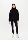 THE UPSIDE Jerome Half Zip Crew in Black is a sustainable organic cotton oversized half zip crew with a soft rib hem and cuffs and kangaroo pocket