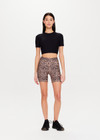 THE UPSIDE Ryker 6inch Spin Short in Leopard print is a sustainable mid-rise 6inch length spin short with contrast printed arrow at centre back and striped elastic down sides.