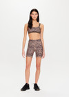 THE UPSIDE Ryker 6inch Spin Short in Leopard print is a sustainable mid-rise 6inch length spin short with contrast printed arrow at centre back and striped elastic down sides.