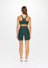 THE UPSIDE Peached 6inch Pocket Spin Short in Dark Green is a recycled mid-rise 6” spin short with pockets and printed arrow at centre back.