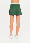 THE UPSIDE Oxford Sloan Skirt in Fern Green is a sustainable pleated tennis skirt with inner shorts, pockets and elastic mint green waistband.