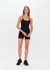 THE UPSIDE women's black Peached Jamie Onesie is a recycled all-in-one 3” onesie with adjustable straps, removable cups and pockets.