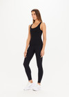 THE UPSIDE women's black, form-fitting Balance Seamless Lenny Tank is made from fabric with moisture control properties and is designed for a soft and supportive fit. This tank top features a scoop neck, cross back straps and shelf bra and bra cups for support.