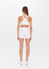 THE UPSIDE women's white Peached 2.5inch Spin Short is a recycled mid-rise 2.5” length spin short in our soft peached fabrication and fully lined for full coverage.