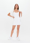 THE UPSIDE women's white scoop neck Peached Brooklyn Dress made with Peached fabric features shelf bra and removable cups, inbuilt shorts with pockets and adjustable straps.
