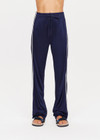 THE UPSIDE womens navy mid rise Celeste Pant made with slinky fabrication features a relaxed straight leg silhouette, elasticated waistband, drawcord, and white stripe down side seams.