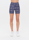 THE UPSIDE women’s mid-rise indigo Yukimi 5 Inch Pocket Spin Short made with Recycled Rib fabric features an abstract print, side pockets and moisture wicking properties; perfect for yoga, pilates or barre.