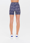 THE UPSIDE women’s mid-rise indigo Yukimi 5 Inch Pocket Spin Short made with Recycled Rib fabric features an abstract print, side pockets and moisture wicking properties; perfect for yoga, pilates or barre.