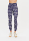 THE UPSIDE women’s indigo Yukimi 25 Inch Midi Pant made with Recycled Rib fabric features an abstract print and white printed arrow logo on back; perfect for yoga, pilates or barre.