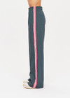 THE UPSIDE womens cool dark blue high waisted wide leg Niseko Monte Pant made with Lenzing viscose soft suiting fabric features elastic waistband, stripe down side seams and side and back pockets.