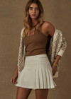THE UPSIDE womens white pleated Pasadena Cher Skirt made with organic cotton features built in shorts with pockets, designed for golf or tennis.