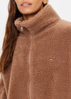 THE UPSIDE women's brown oversized Hudson Jacket made with faux shearling features a high neck collar with zipper, drawcord at waist and pockets. Fully lined, designed for winter.
