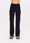THE UPSIDE women's black Onyx Alina Pant is made from a recycled soft peached fabric with a brushed handfeel. This straight leg pant features a drawcord at the waist and moisture-wicking, breathable and quick-drying properties.